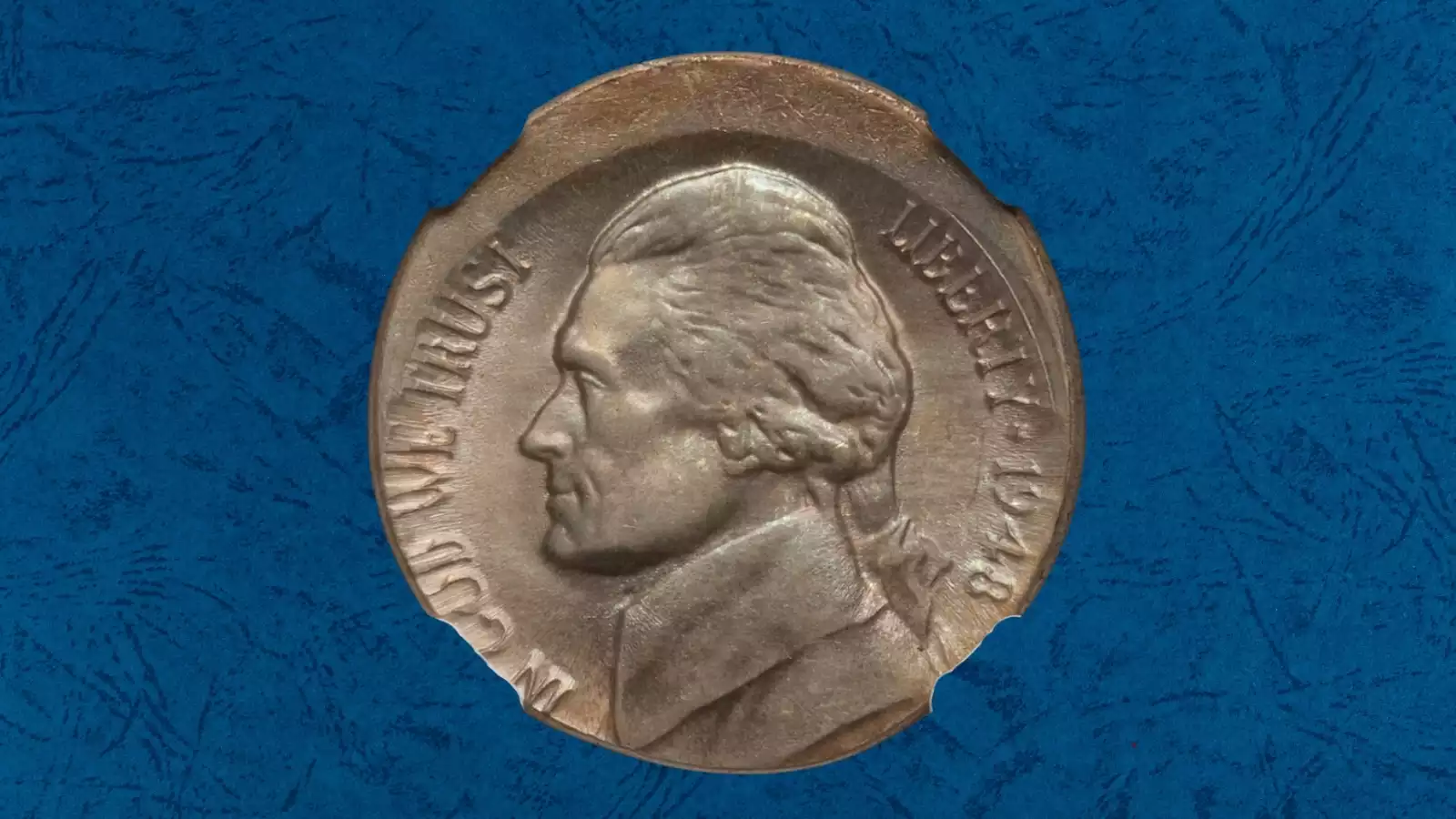 1948 nickel off-center strike error showing design displaced with a blank crescent area and the 1948 date still clearly visible on the struck portion